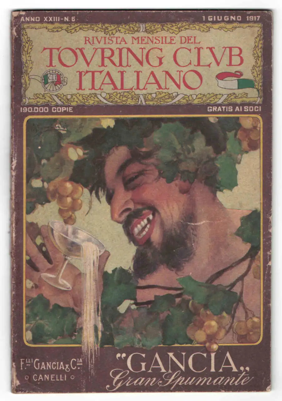 Copertina della Rivista Mensile del Touring Club Italiano del 1° giugno 1917, con illustrazione pubblicitaria Gancia raffigurante una figura sorridente tra foglie d’uva mentre versa un calice di spumante.